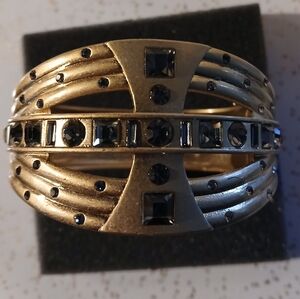 Lia Sophia Graduated Gold Tone crystals hinged bracelet.